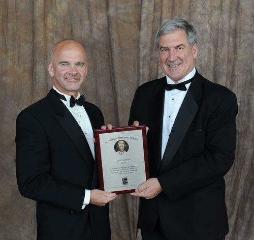Director Garth Kirkham P.Geo., P.Geoph. (left) on being awarded the Canadian Institute of Mining’s 2010 JC Sproule Memorial Plaque